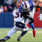ORCHARD PARK, NEW YORK - NOVEMBER 24: Justin Simmons #31 of the Denver Broncos tackles Robert Foster #16 of the Buffalo Bills during the second quarter of an NFL game at New Era Field on November 24, 2019 in Orchard Park, New York. (Photo by Bryan M. Bennett/Getty Images)