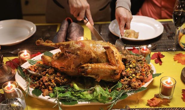 STAMFORD, CT - NOVEMBER 24: A Guatemalan immigrant carves the Thanksgiving turkey on November 24, 2...
