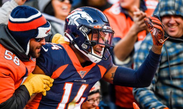 DENVER, CO - DECEMBER 1:  Courtland Sutton #14 of the Denver Broncos is congratulated by fans after...