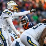 DENVER, CO - DECEMBER 1:  Philip Rivers #17 of the Los Angeles Chargers runs the offense against the Denver Broncos in the second quarter of a game at Empower Field at Mile High on December 1, 2019 in Denver, Colorado.  (Photo by Dustin Bradford/Getty Images)