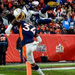 DENVER, CO - DECEMBER 1:  Keenan Allen #13 of the Los Angeles Chargers leaps over Will Parks #34 of the Denver Broncos to score a third quarter touchdown on a reception at Empower Field at Mile High on December 1, 2019 in Denver, Colorado.  (Photo by Dustin Bradford/Getty Images)