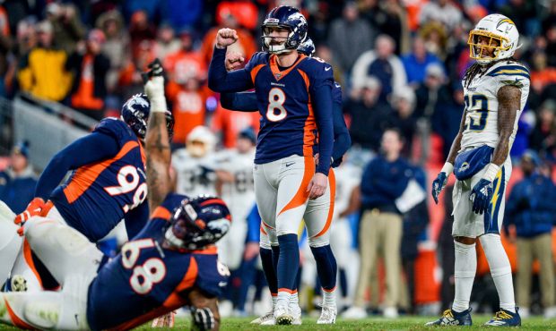 DENVER, CO - DECEMBER 1: Brandon McManus #8 of the Denver Broncos celebrates after kicking a game-w...