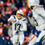 DENVER, CO - DECEMBER 1:  Philip Rivers #17 of the Los Angeles Chargers completes a pass to Keenan Allen #13 in the fourth quarter of a game against the Denver Broncos at Empower Field at Mile High on December 1, 2019 in Denver, Colorado.  (Photo by Dustin Bradford/Getty Images)