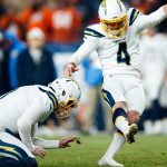 DENVER, CO - DECEMBER 1:  Place kicker Michael Badgley #4 of the Los Angeles Chargers successfully kicks a field goal in the fourth quarter to tie the game against the Denver Broncos  at Empower Field at Mile High on December 1, 2019 in Denver, Colorado. The Broncos defeated the Chargers 23-20. (Photo by Justin Edmonds/Getty Images)
