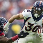 HOUSTON, TX - DECEMBER 8:  Phillip Lindsay #30 of the Denver Broncos breaks the tackle of Zach Cunningham #41 of the Houston Texans during the first half at NRG Stadium on December 8, 2019 in Houston, Texas.   (Photo by Wesley Hitt/Getty Images)
