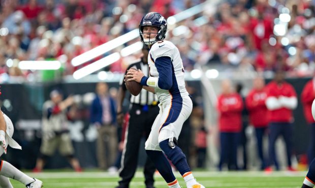 HOUSTON, TX - DECEMBER 8:  Drew Lock #3 of the Denver Broncos drops back to pass during the second ...