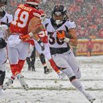 KANSAS CITY, MO - DECEMBER 15:  Running back Phillip Lindsay #30 of the Denver Broncos rushes down field for a first down against the Kansas City Chiefs during the second half at Arrowhead Stadium on December 15, 2019 in Kansas City, Missouri. (Photo by Peter Aiken/Getty Images)