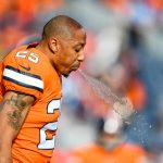 DENVER, CO - DECEMBER 22:  Chris Harris #25 of the Denver Broncos spits water as he warms up before a game against the Detroit Lions at Empower Field at Mile High on December 22, 2019 in Denver, Colorado.  (Photo by Dustin Bradford/Getty Images)