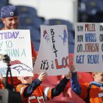 DENVER, CO - DECEMBER 22:  Young Denver Broncos fans hold up signs prior to a regular season game between the Denver Broncos and the visiting Detroit Lions on December 22, 2019 at Empower Field at Mile High in Denver, CO.  (Photo by Russell Lansford/Icon Sportswire via Getty Images)