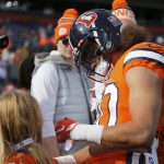 DENVER, CO - DECEMBER 22:  Denver Broncos Running Back Phillip Lindsay (30) autographs a young fan's jersey prior a regular season game between the Denver Broncos and the visiting Detroit Lions on December 22, 2019 at Empower Field at Mile High in Denver, CO.  (Photo by Russell Lansford/Icon Sportswire via Getty Images)