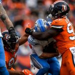 DENVER, CO - DECEMBER 22:  David Blough #10 of the Detroit Lions is sacked by Jeremiah Attaochu #97 of the Denver Broncos in the first quarter of a game at Empower Field at Mile High on December 22, 2019 in Denver, Colorado.  (Photo by Dustin Bradford/Getty Images)