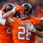 DENVER, CO - DECEMBER 22:  Royce Freeman #28 of the Denver Broncos is congratulated after a second quarter touchdown against the Detroit Lions at Empower Field on December 22, 2019 in Denver, Colorado. (Photo by Dustin Bradford/Getty Images)