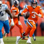 DENVER, CO - DECEMBER 22:  Quarterback Drew Lock #3 of the Denver Broncos runs with the football as defensive end Frank Herron #75 of the Detroit Lions chases during the second quarter at Empower Field at Mile High on December 22, 2019 in Denver, Colorado. (Photo by Justin Edmonds/Getty Images)
