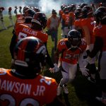 DENVER, CO - DECEMBER 29:  Cornerback Chris Harris #25 of the Denver Broncos runs through a tunnel of teammates as he takes the field before a game against the Oakland Raiders at Empower Field at Mile High on December 29, 2019 in Denver, Colorado. (Photo by Justin Edmonds/Getty Images)