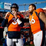 DENVER, CO - DECEMBER 29:  Quarterback Drew Lock #3 of the Denver Broncos and offensive guard Dalton Risner #66 of the Denver Broncos share a laugh before a game against the Oakland Raiders at Empower Field at Mile High on December 29, 2019 in Denver, Colorado. (Photo by Justin Edmonds/Getty Images)