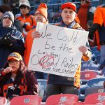 DENVER, CO - DECEMBER 29:  A Denver Broncos fan holds up an Oakland Raiders sign prior to a regular season game between the Denver Broncos and the visiting Oakland Raiders on December 29, 2019 at Empower Field at Mile High in DENVER, CO - DECEMBER 29: (Photo by Russell Lansford/Icon Sportswire via Getty Images)