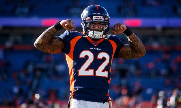 DENVER, CO - DECEMBER 01: Cornerback Kareem Jackson #22 of the Denver Broncos flexes his muscles be...