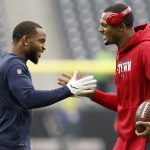HOUSTON, TEXAS - DECEMBER 08:  Kareem Jackson #22 of the Denver Broncos and Deshaun Watson #4 of the Houston Texans greet each other during warm ups before the game at NRG Stadium on December 08, 2019 in Houston, Texas. (Photo by Tim Warner/Getty Images)