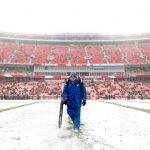 KANSAS CITY, MISSOURI - DECEMBER 15: A grounds worker clears snow on the field prior to the game at Arrowhead Stadium between the Kansas City Chiefs and the Denver Broncos on December 15, 2019 in Kansas City, Missouri. (Photo by David Eulitt/Getty Images)