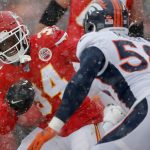 KANSAS CITY, MISSOURI - DECEMBER 15: Darwin Thompson #34 of the Kansas City Chiefs rushes with the ball against Von Miller #58 of the Denver Broncos in the game at Arrowhead Stadium on December 15, 2019 in Kansas City, Missouri. (Photo by David Eulitt/Getty Images)