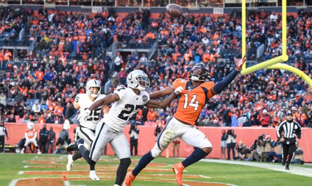 DENVER, CO - DECEMBER 29: Trayvon Mullen (27) of the Oakland Raiders commits pass interference on C...