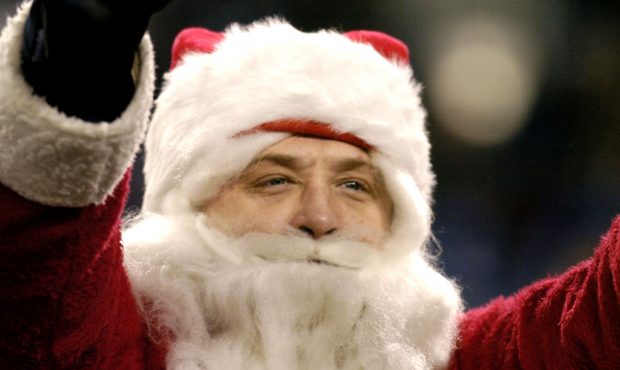 Santa cheers the action as the Tennessee Titans play against the Denver Broncos December 25, 2004 i...