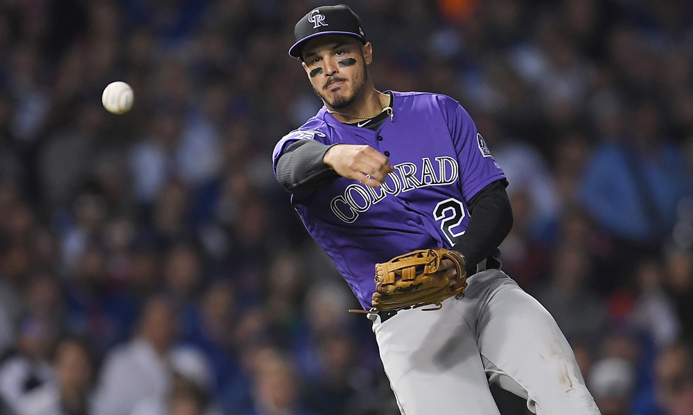 CHICAGO, IL - OCTOBER 02: Nolan Arenado #28 of the Colorado Rockies throws to first base in the fifth inning against the Chicago Cubs during the National League Wild Card Game at Wrigley Field on October 2, 2018 in Chicago, Illinois. (Photo by Stacy Revere/Getty Images)