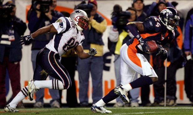 DENVER - JANUARY 14: Cornerback Champ Bailey #24 of the Denver Broncos intercepts a pass in front o...