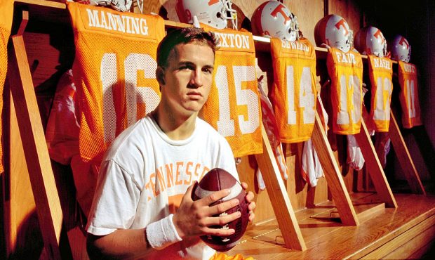 Quaterback Peyton Manning #16 of the Tennessee Volunteers poses for a portrait in the locker room c...