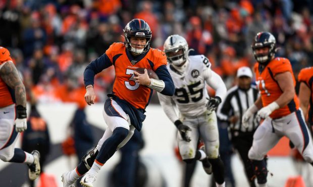 DENVER, CO - DECEMBER 29:  Drew Lock #3 of the Denver Broncos scrambles against the Oakland Raiders...