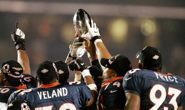 The Denver Broncos hold up the Lombardi Trophy after defeating the Green Bay Packers in Super Bowl ...