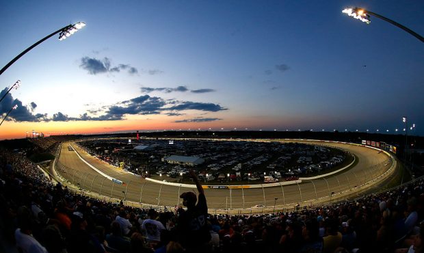 A general view of cars racing at sunset during the NASCAR Sprint Cup Series Bojangles' Southern 500...