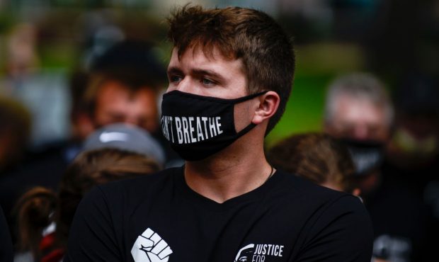 Denver Broncos quarterback Drew Lock joins his teammates at a protest for the death of George Floyd...