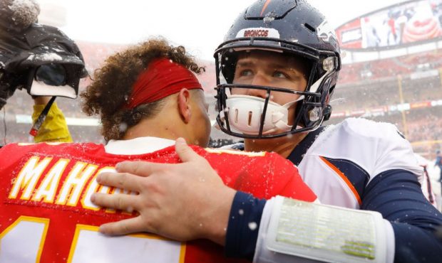 Drew Lock #3 of the Denver Broncos greets Patrick Mahomes #15 of the Kansas City Chiefs following t...