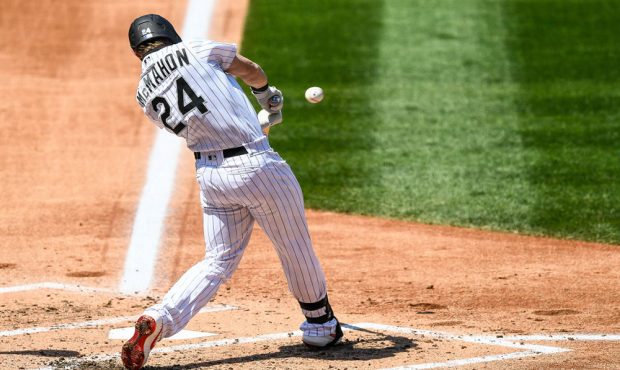 DENVER, CO - AUGUST 16: Colorado Rockies second baseman Ryan McMahon (24) hits a second inning thre...