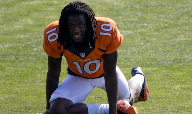 ENGLEWOOD, CO - AUGUST 17: Wide receiver Jerry Jeudy #10 of the Denver Broncos smiles while stretch...