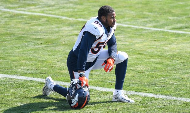 Linebacker Malik Reed #59 of the Denver Broncos kneels on the field during a training session at UC...