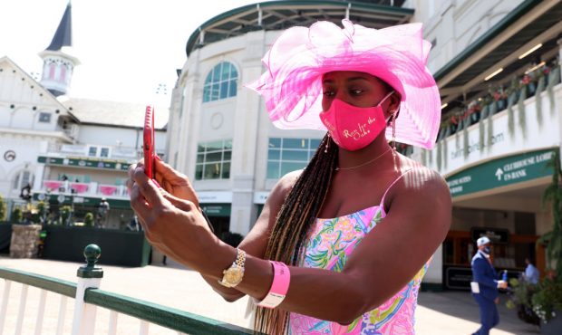 A woman takes a selfie ahead of the 146th running of the Kentucky Derby at Churchill Downs on Septe...