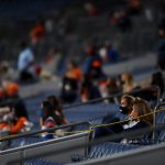 Family and friends of Denver Broncos players look on from the stands as the Broncos concede a fourth inning lead to the Tennessee Titans at Empower Field at Mile High on September 14, 2020 in Denver, Colorado. (Photo by Dustin Bradford/Getty Images)