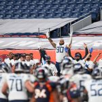 Tennessee Titans players, including DaQuan Jones #90, celebrate after a fourth quarter go-ahead field goal against the Denver Broncos at Empower Field at Mile High on September 14, 2020 in Denver, Colorado. (Photo by Dustin Bradford/Getty Images)