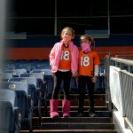 Zia Azzanni, 9, left, and Ashlyn Motosaka, 9, arrive their seats for Denver Broncos game against Tampa Bay Buccaneers at Empower Field at Mile High in Denver, Colorado on Snuday. September 27, 2020. Denver Broncos hosts the Tampa Bay Buccaneers and 5,700 socially-distanced fans for the week three game (Photo by Hyoung Chang/MediaNews Group/The Denver Post via Getty Images)