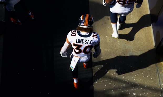 FOXBOROUGH, MA - OCTOBER 18: Phillip Lindsay #30 of the Denver Broncos makes his way onto the field...