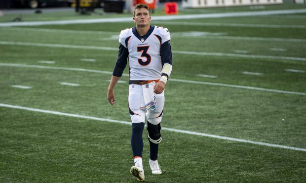 FOXBOROUGH, MA - OCTOBER 18: Drew Lock #3 of the Denver Broncos walks off the field after a victory...