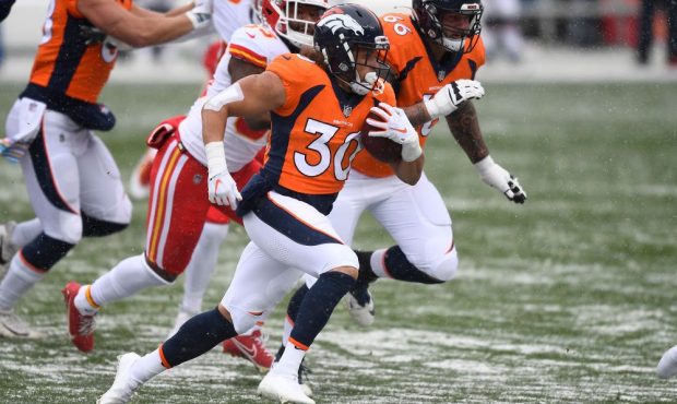 Phillip Lindsay #30 of the Denver Broncos rushes with the ball against the Kansas City Chiefs in th...