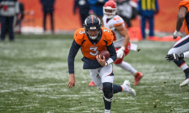 DENVER, CO - OCTOBER 25:  Drew Lock #3 of the Denver Broncos rushes for a first quarter touchdown a...