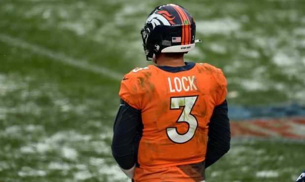 Denver Broncos quarterback Drew Lock watches from the sidelines as the clock ticks down during the ...