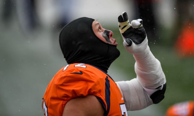 DENVER, CO - OCTOBER 25: Garett Bolles #72 of the Denver Broncos points to the sky before a game ag...