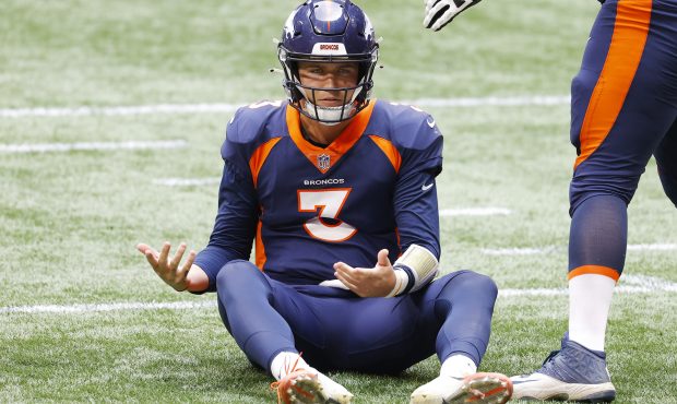 Drew Lock #3 of the Denver Broncos reacts on the ground during the second half against the Atlanta ...