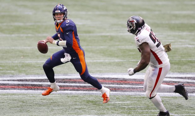 Drew Lock #3 of the Denver Broncos looks to pass during the second half against the Atlanta Falcons...
