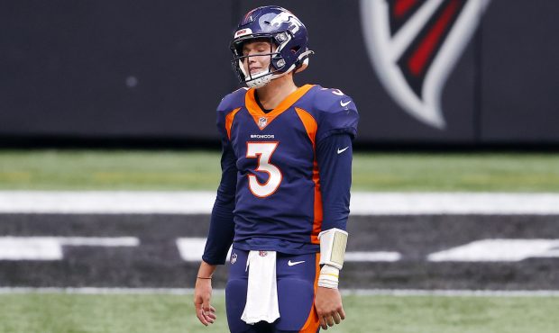 Drew Lock #3 of the Denver Broncos reacts after an illegal shift penalty during the fourth quarter ...